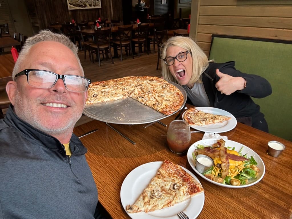 Jeff and Patricia sharing a big pizza at the Robbers Cave State Park restaurant.