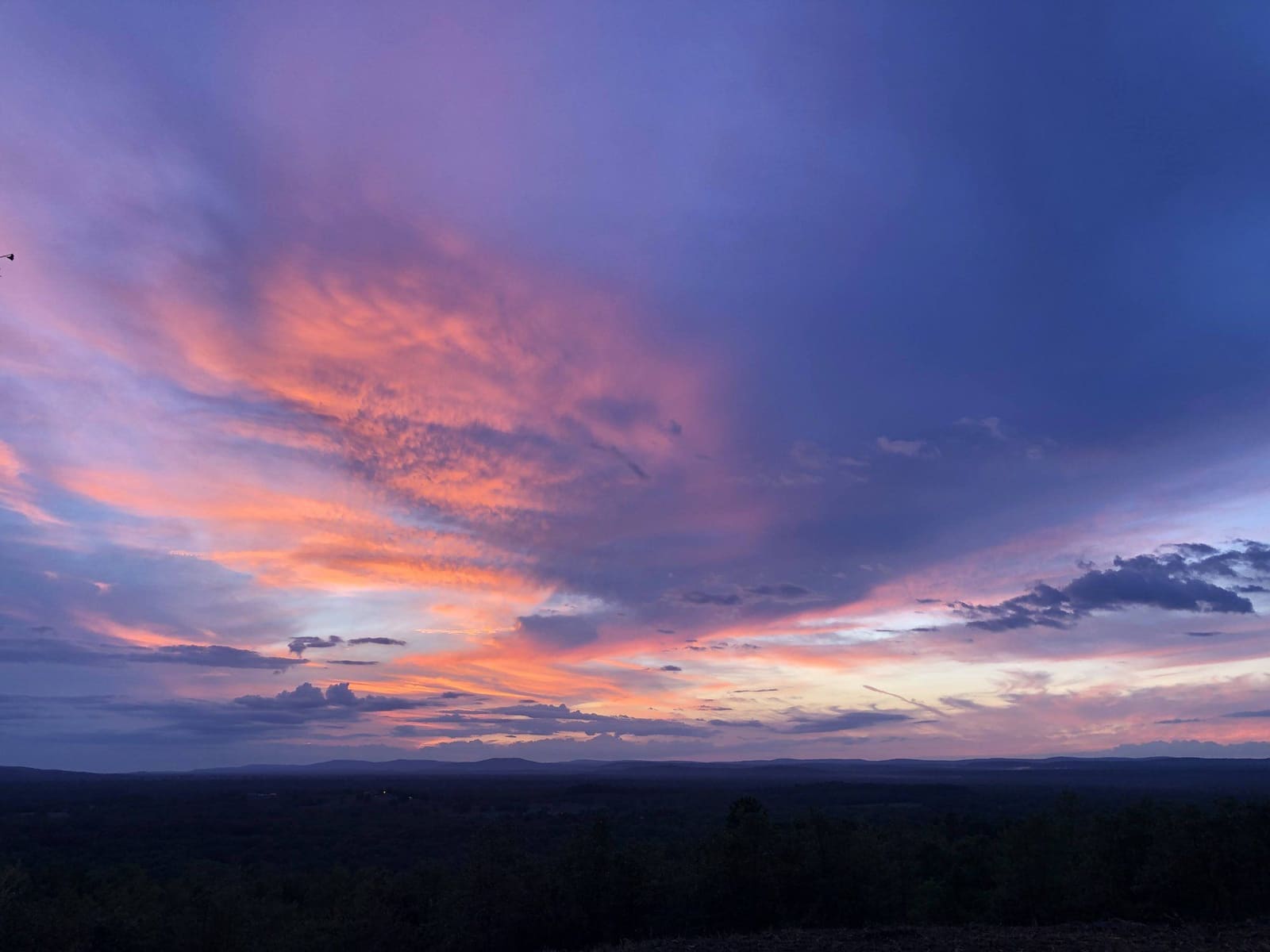 Sunset clouds over the hills from the ranch