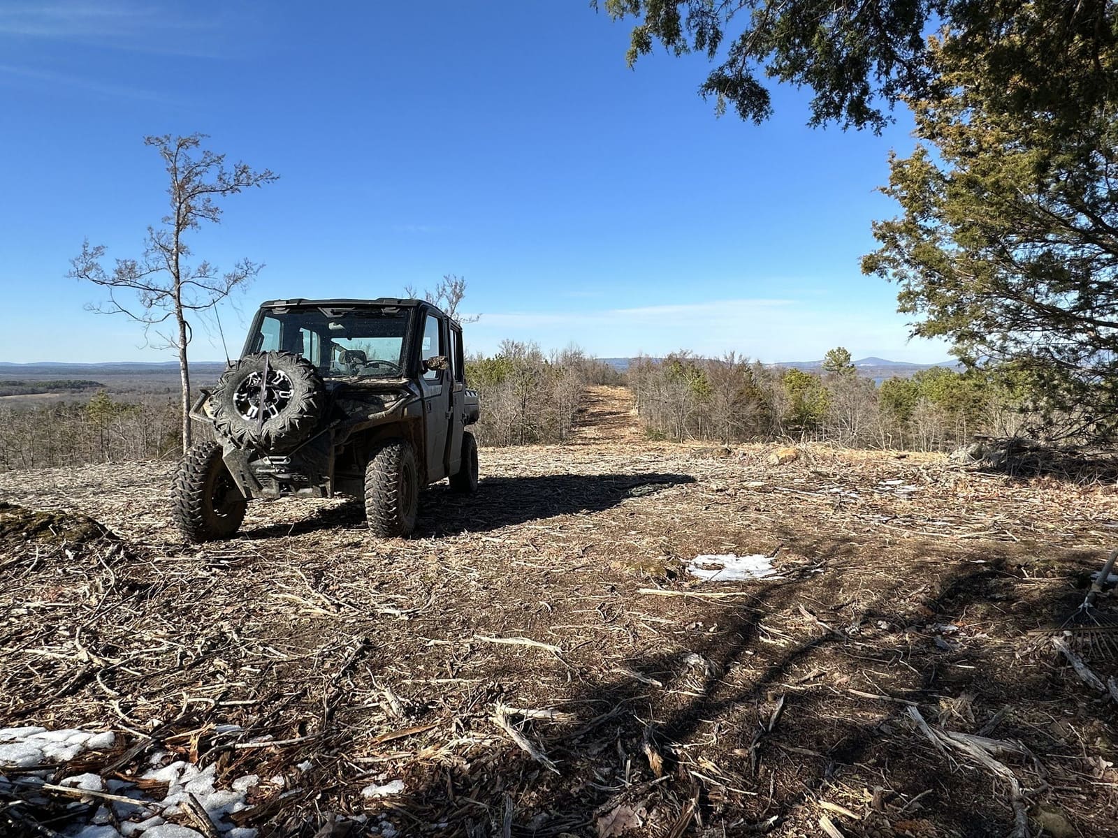 A side-by-side parked on the hilltop