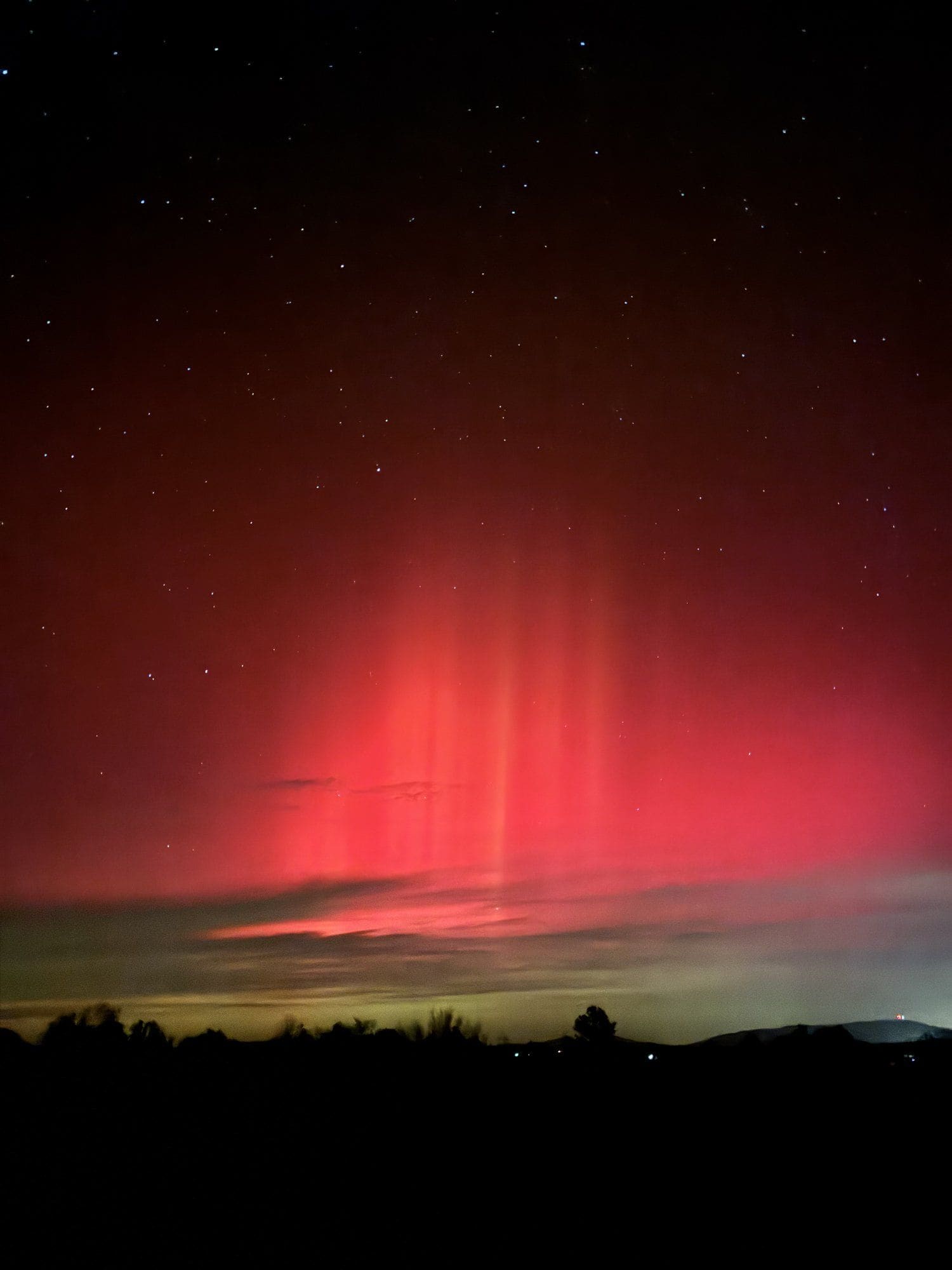 Northern lights over the hill